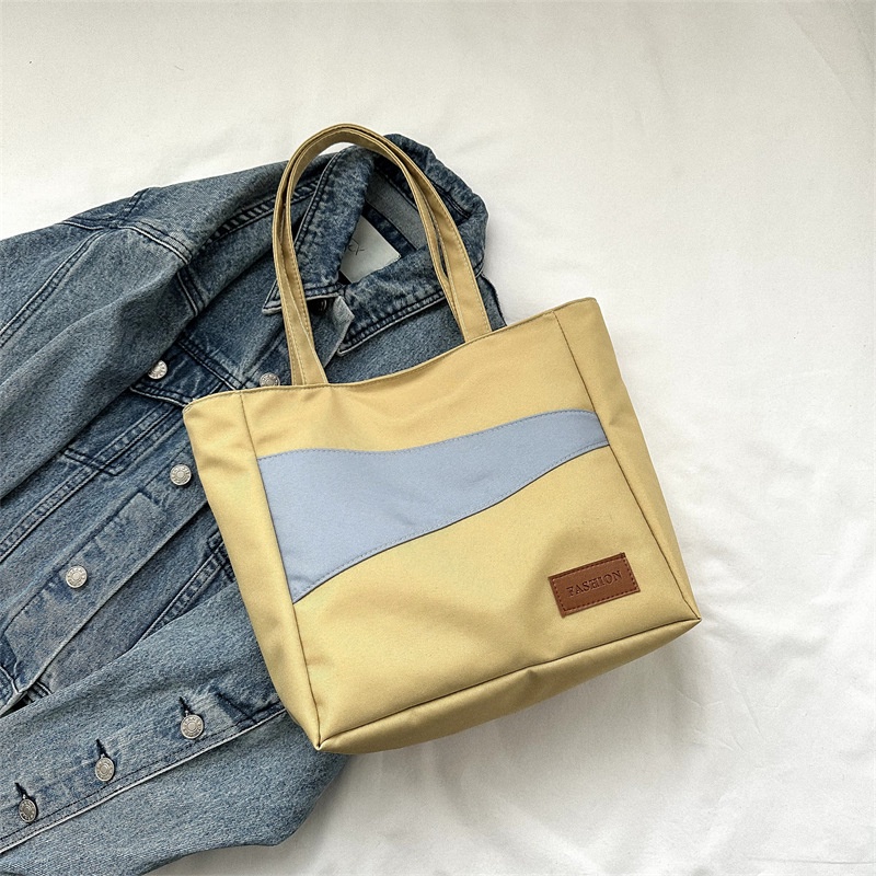 Tas wanita import berkualitas harga grosir bisa cod Kain Oxford kapasitas besar tas santai 2023 musim semi dan musim panas gaya baru tahun ini fashion satu bahu tas ketiak tas ember