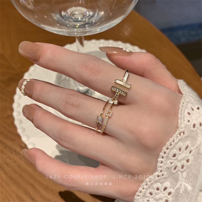 Cincin Zirkon Mutiara Temperamen Sederhana Prancis Korea drip glaze double T ring