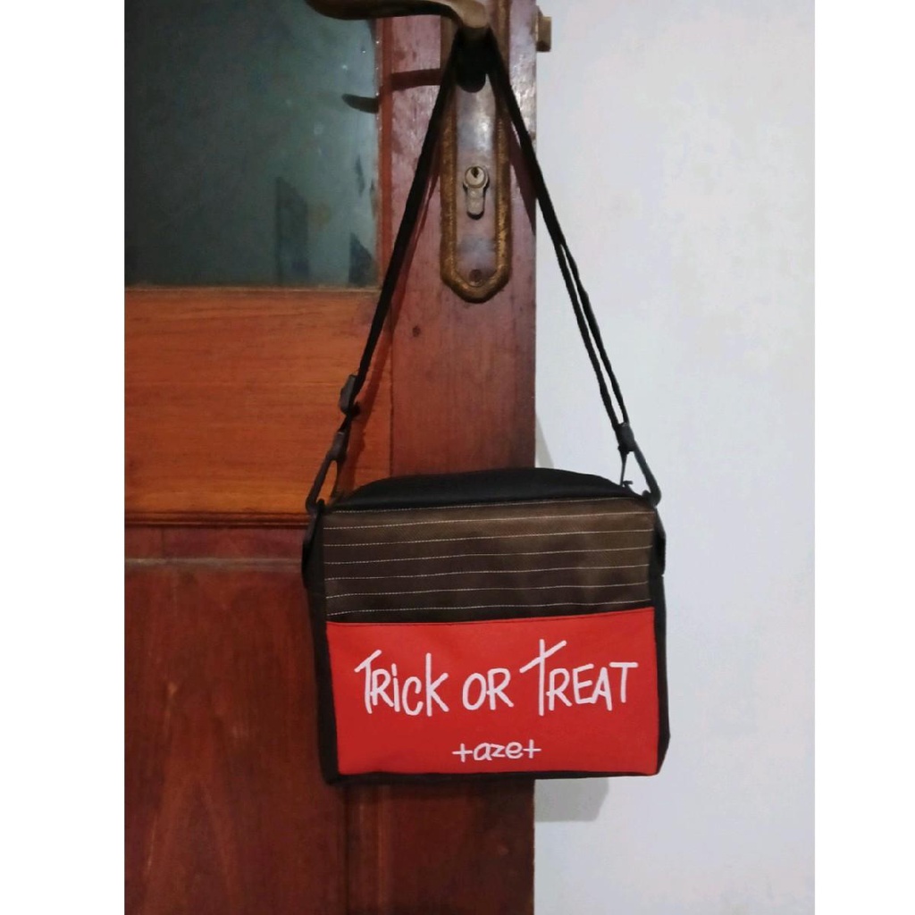 New tas selempang pria wanita motif trick or treat kekinian yang lagi trending termurah