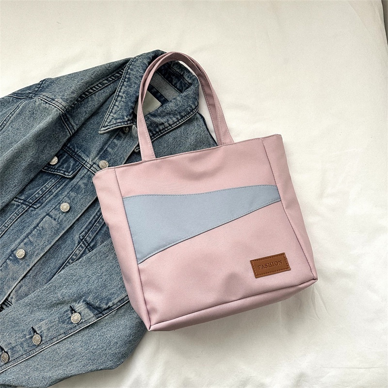 Tas wanita import berkualitas harga grosir bisa cod Kain Oxford kapasitas besar tas santai 2023 musim semi dan musim panas gaya baru tahun ini fashion satu bahu tas ketiak tas ember