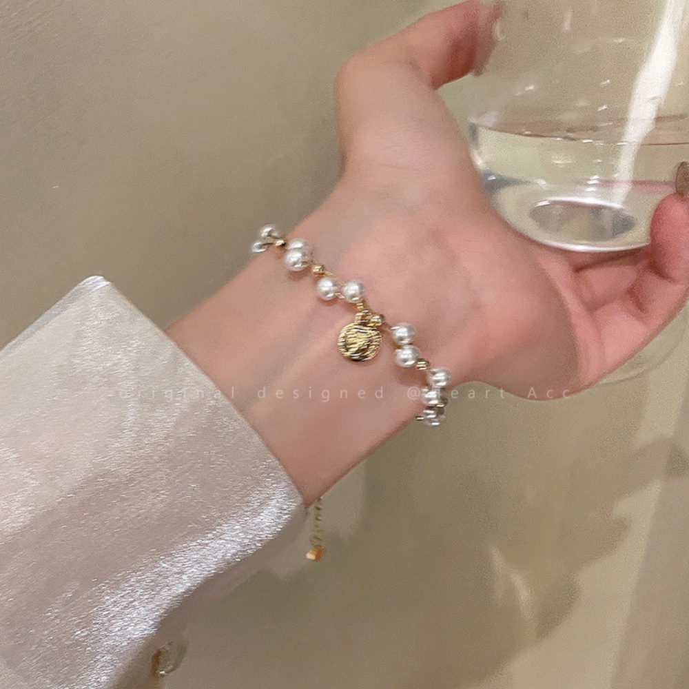 Eropa Amerika Retro Mutiara Kalung Wanita High-end Desain Rasa Niche Berliku Rantai Tulang Selangka Angin Dingin Potret Liontin Aksesoris Perhiasan Gadis Seksi