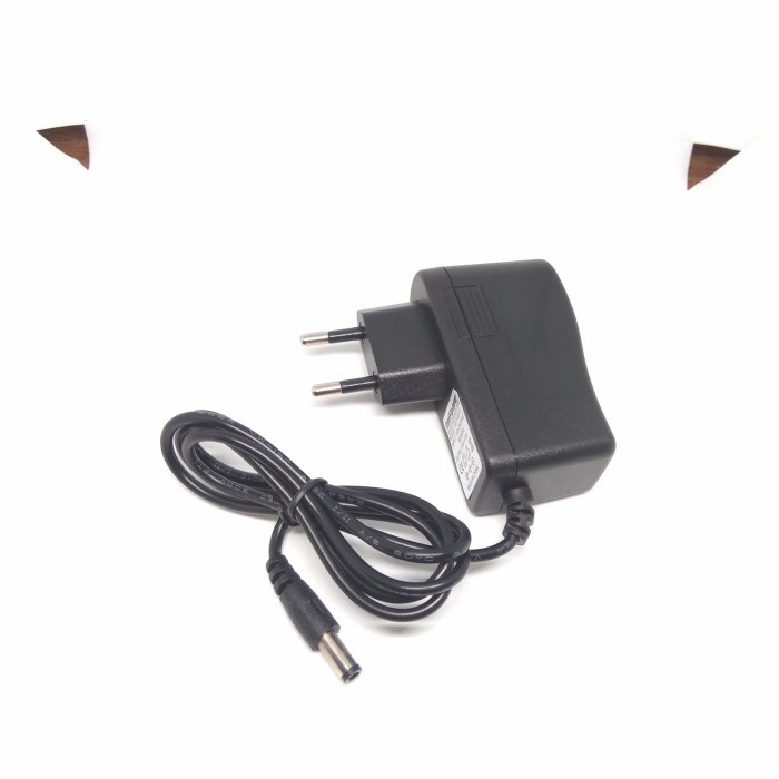 Adaptor 9V 1A negative center untuk efek gitar, piano, dll.