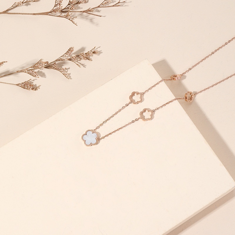 Kalung gelang anting bunga keramik putih titanium