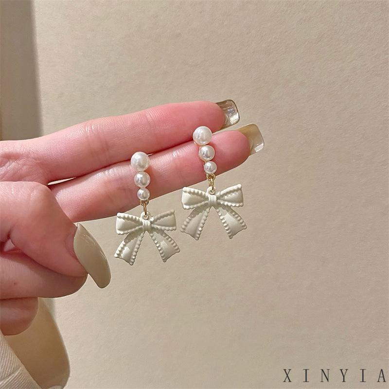 【Bayar di tempat】S925 Off-white  Busur Anting Mutiara Perempuan Berlebihan Anting Vintage Temperamen Senior Rasa Perhiasan Telinga