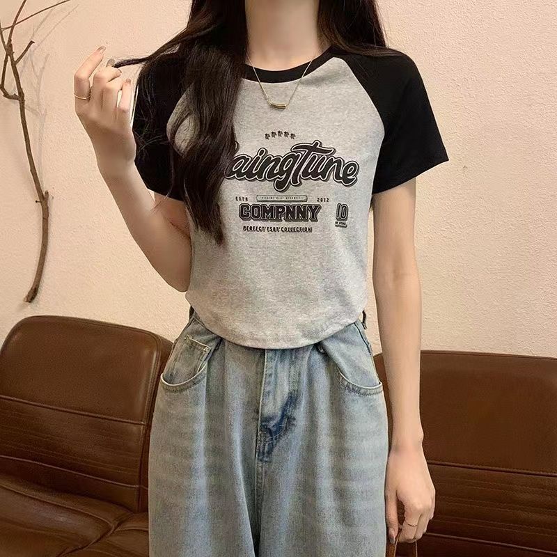 Red Kapas murni musim panas versi Korea longgar lengan pendek wanita bagian pendek tidak beraturan tipis dan menutup perut atasan kaos bahu depan yang manis dan pedas