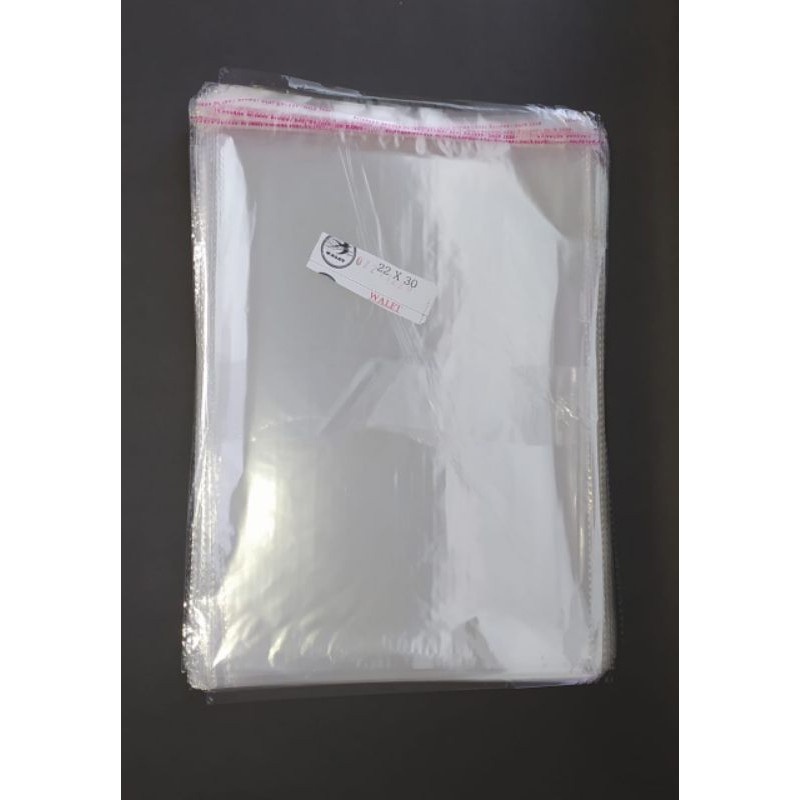 OPP Lem uk 22x28 + 2 cm Lidah Seal Lem / Plastik Pembungkus dengan Perekat @100lbr/pack