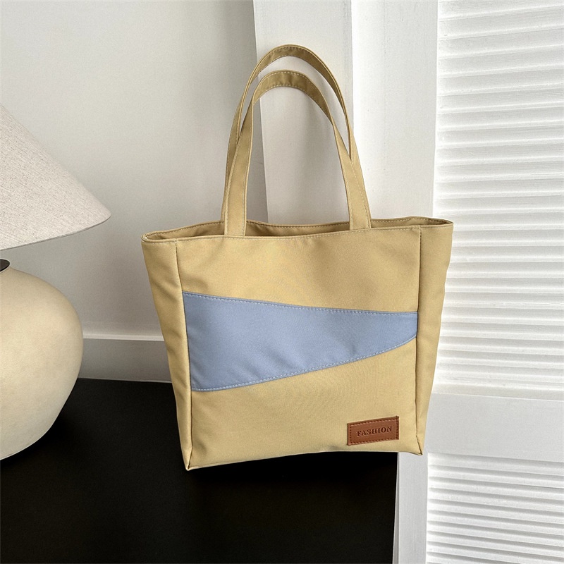 Tas wanita import berkualitas harga grosir bisa cod Kain Oxford kapasitas besar tas santai 2023 musim semi dan musim panas gaya baru tahun ini fashion satu bahu tas ketiak tas ember