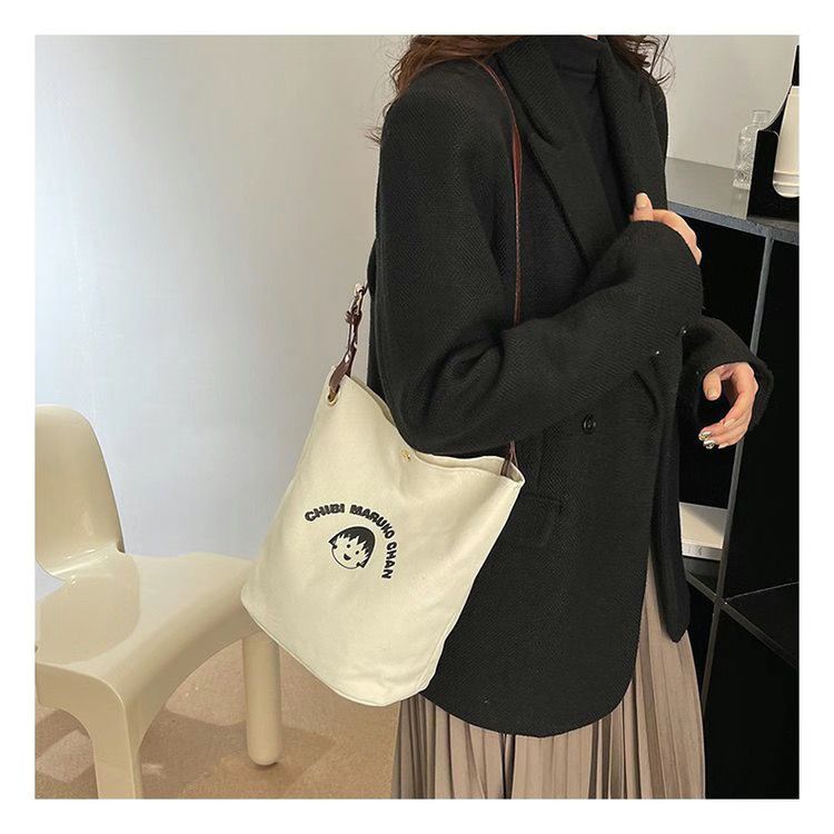 ♧✆❀Sera  Nanfeng co-branded dreamer bucket bag pekerja kantor single shoulder Messenger tas kanvas wajah tersenyum niche tas wanita all-match