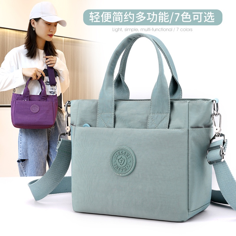 [IMURA]  MR701 Tas wanita baru Jielangshi dengan bahan warna polos, bahu tunggal portabel, tas pengirim multi-saku, ringan, dan berkapasitas besar.