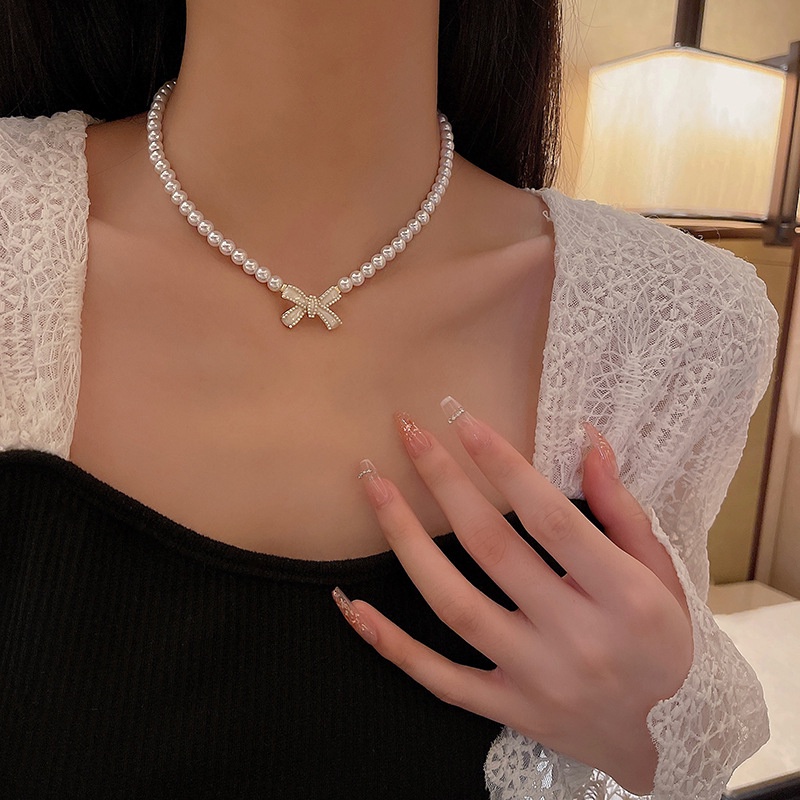 Ay (CN) Kalung Rantai Manik Mutiara Choker Liontin Busur Putih Elegan Untuk Aksesoris Perhiasan Wanita