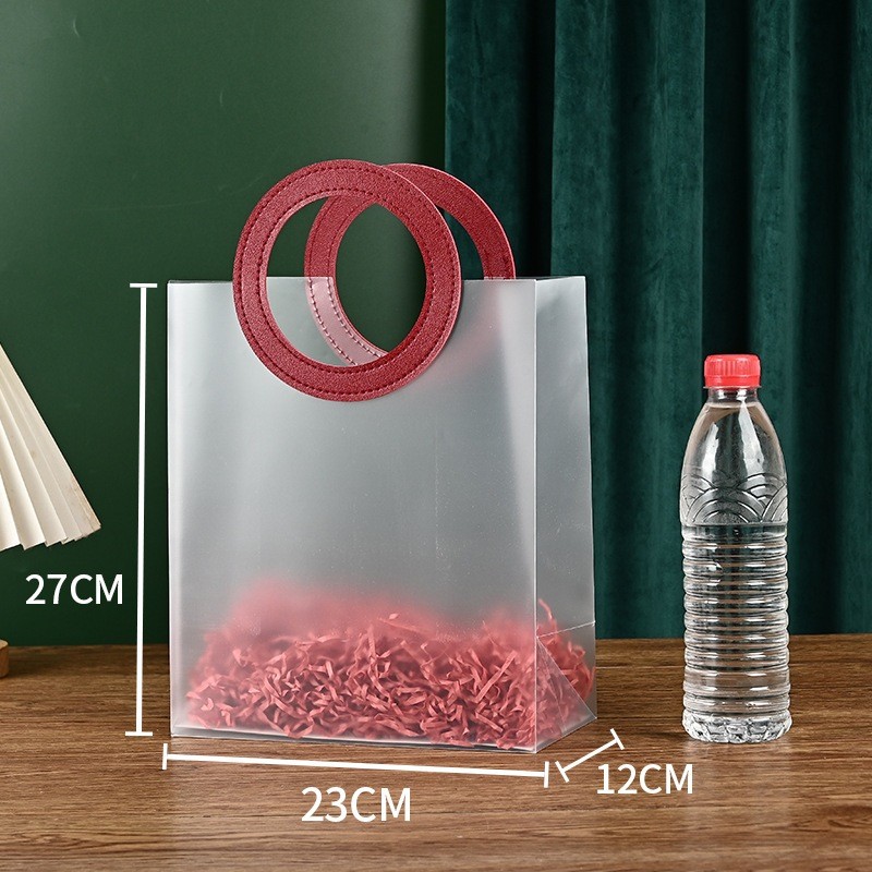 

TAS MIKA PVC BULAT MERAH - UKURAN 27 X 12 X 23 CM - SIZE BESAR