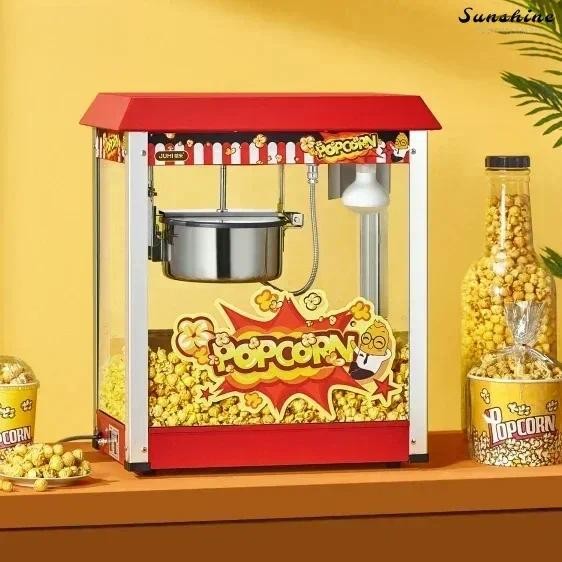 Orange rice popcorn machine. Automatic popcorn machine. Commercial spherical butterfly shaped electr