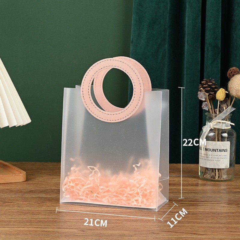 

TAS MIKA PVC BULAT PINK - UKURAN 22 X 11 X 21 CM - SIZE SEDANG