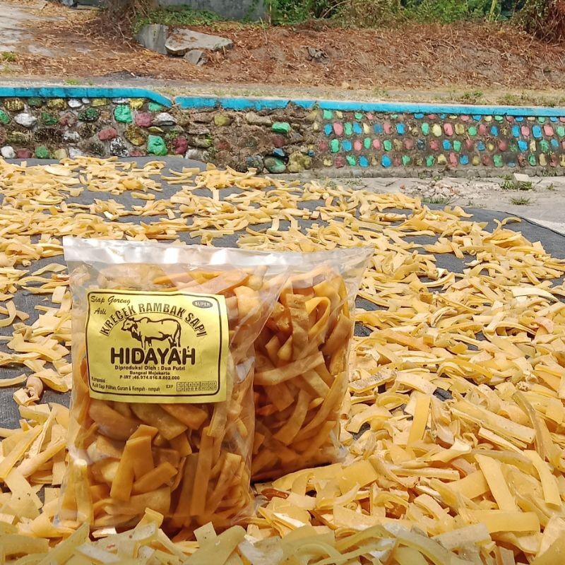 

Kerupuk Kulit Sapi 1 Kg / Krecek Rambak Kulit Sapi / Jangek Mentah / Kerupuk Dorokdok Mentah / STIK LEBAR