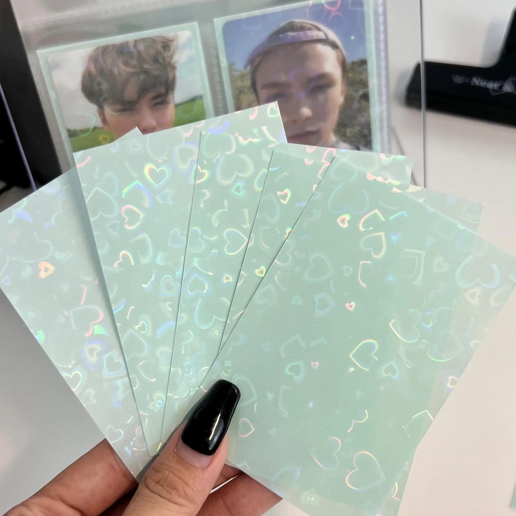 

50pcs/lot 61*91mm Heart Love Laser Flashing Card Sleeves Protector For Photo Cards Holder Holographic Foil Protective Films