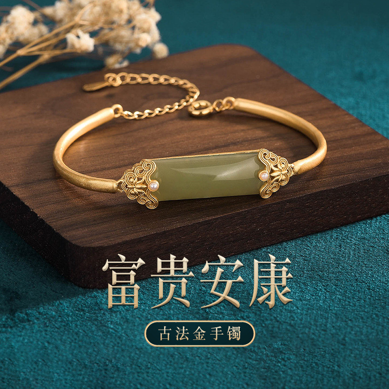 Goyang cepat gaya retro Guochao bertatahkan imitasi Hetian giok safir tebal matte emas berlapis kera