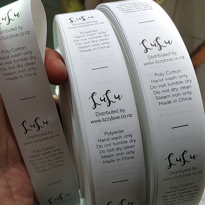 

1000PCS Custom logo white care label 2.5 * 5.7 cm coated tape roll print washing Labels