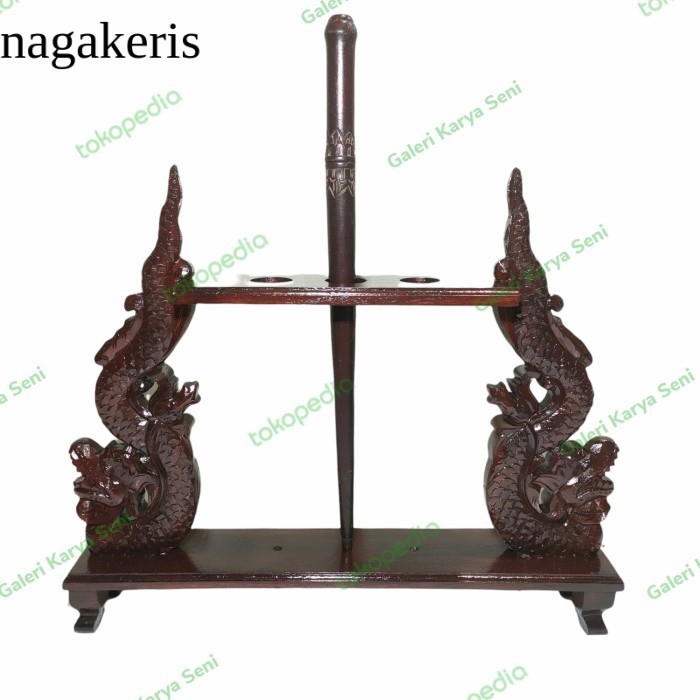 

Jagrak Tombak Isi 3 Ukiran Nagaraja Keraton Plitur Coklat Antik Jati terlaris murah