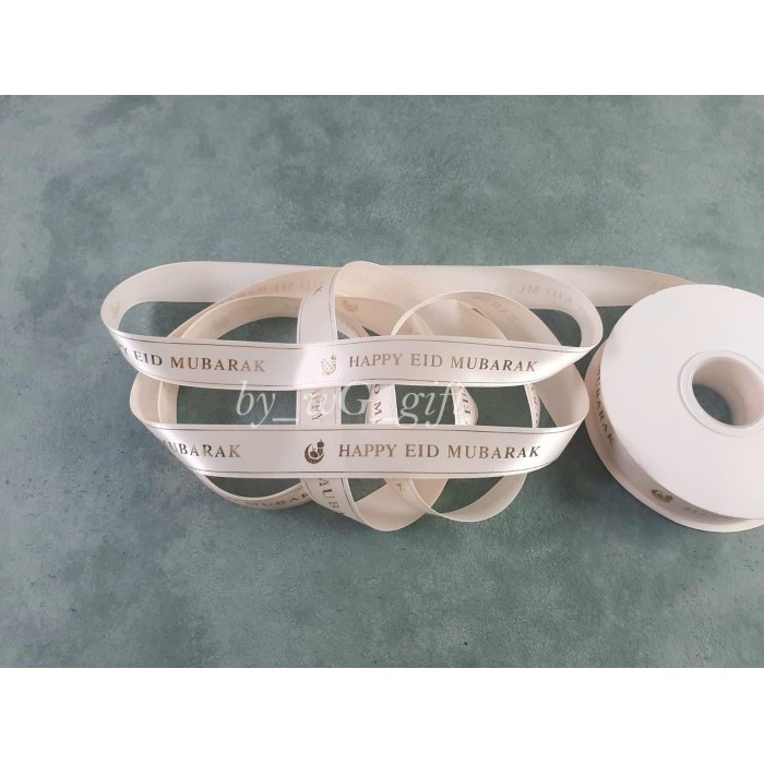 

Pita Idul Fitri - Happy Eid Mubarak - Satin Emboss Emas; Lebar 2.5 cm - BrokenWhite 810, 25 Yard