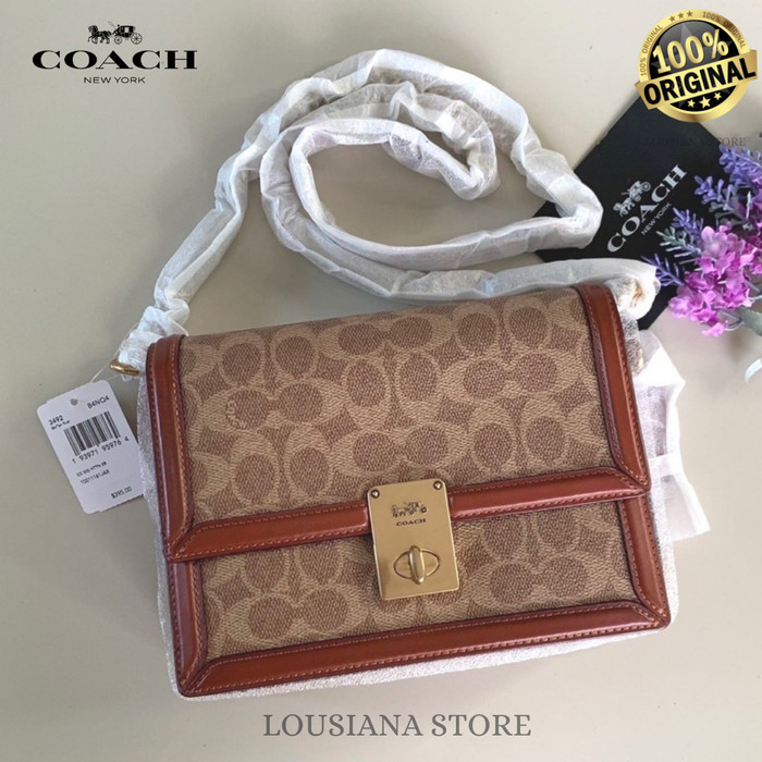 Ċöāĉħ Hutton Shoulder Bag In Signature Canvas Tan Rust