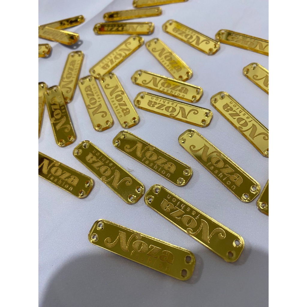 

Label akrilik label baju custom label hijab label rebranding label mirror gold size 3x1 cm Minimal Pembelian 200 Pcs