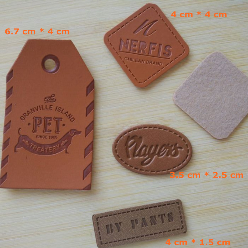 

500pcs Custom pu leather embossed fonts pants label 4 * 4 cm brown swing tag clothing