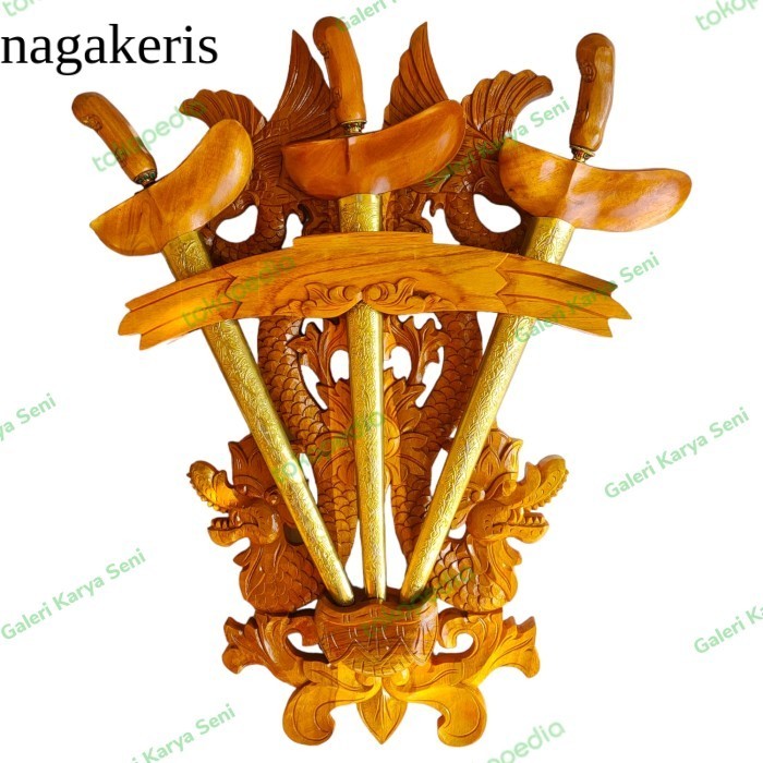 

Blawong Keris Isi 3 Ukir Naga Raja Dan burung Garuda Kembar Kayu Jati terlaris murah