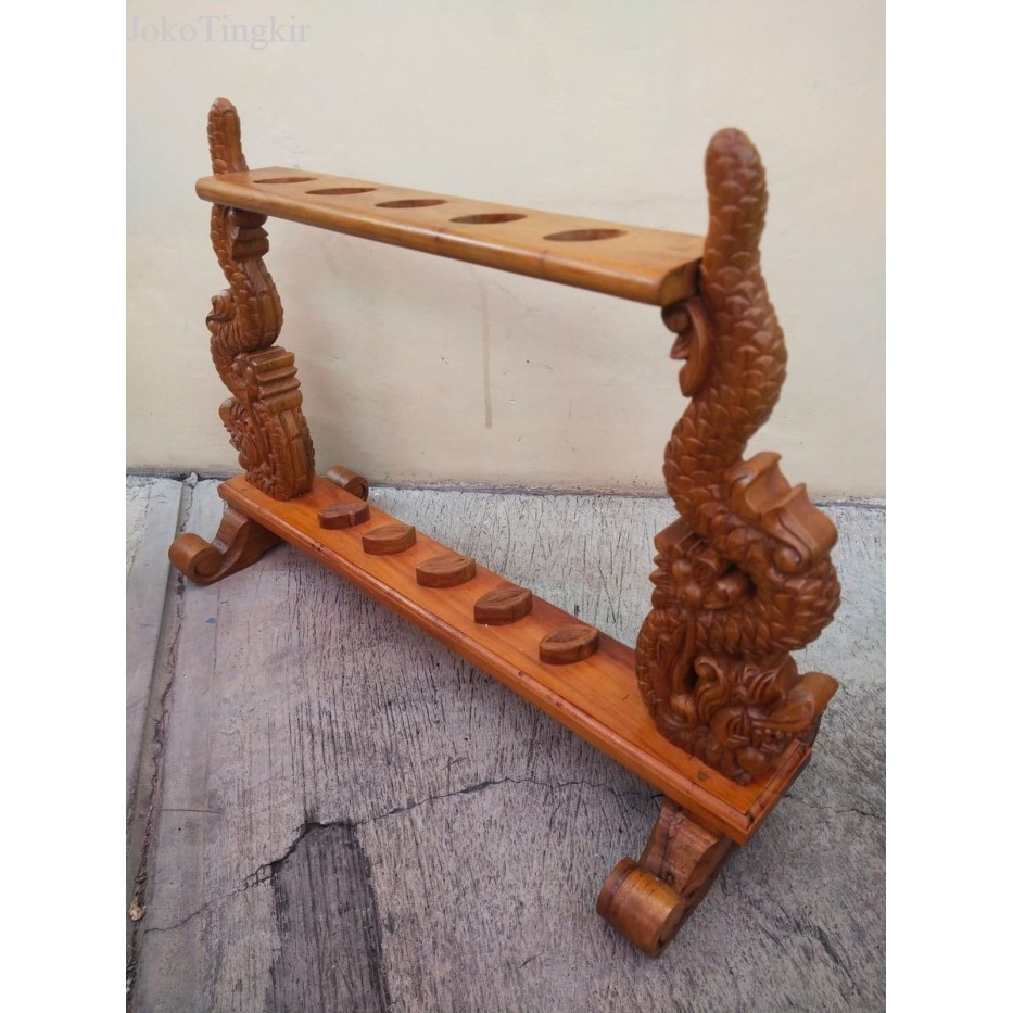 

jagrak keris ukir naga bahan kayu jati isi lima keris kuat murah