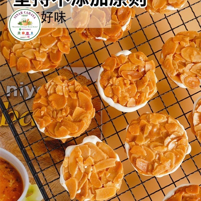 

Cemilan Biskuit Almond Nougat 偏桃仁夹心酥拉丝牛轧杏仁脆饼干
