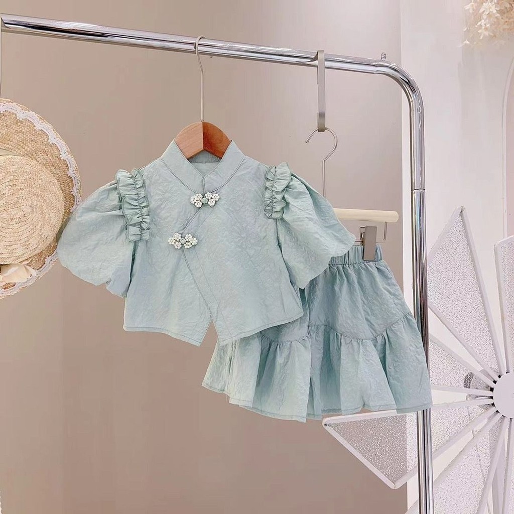 Two piece set of Chinese style buckle cheongsam and lotus leaf skirt for girls