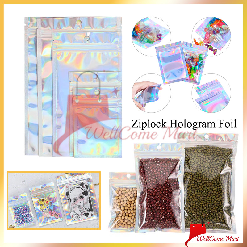 

Plastik Klip Hologram Flat / Plastik Ziplock Hologram Rainbow / Plastik Klip Kemasan Aksesoris