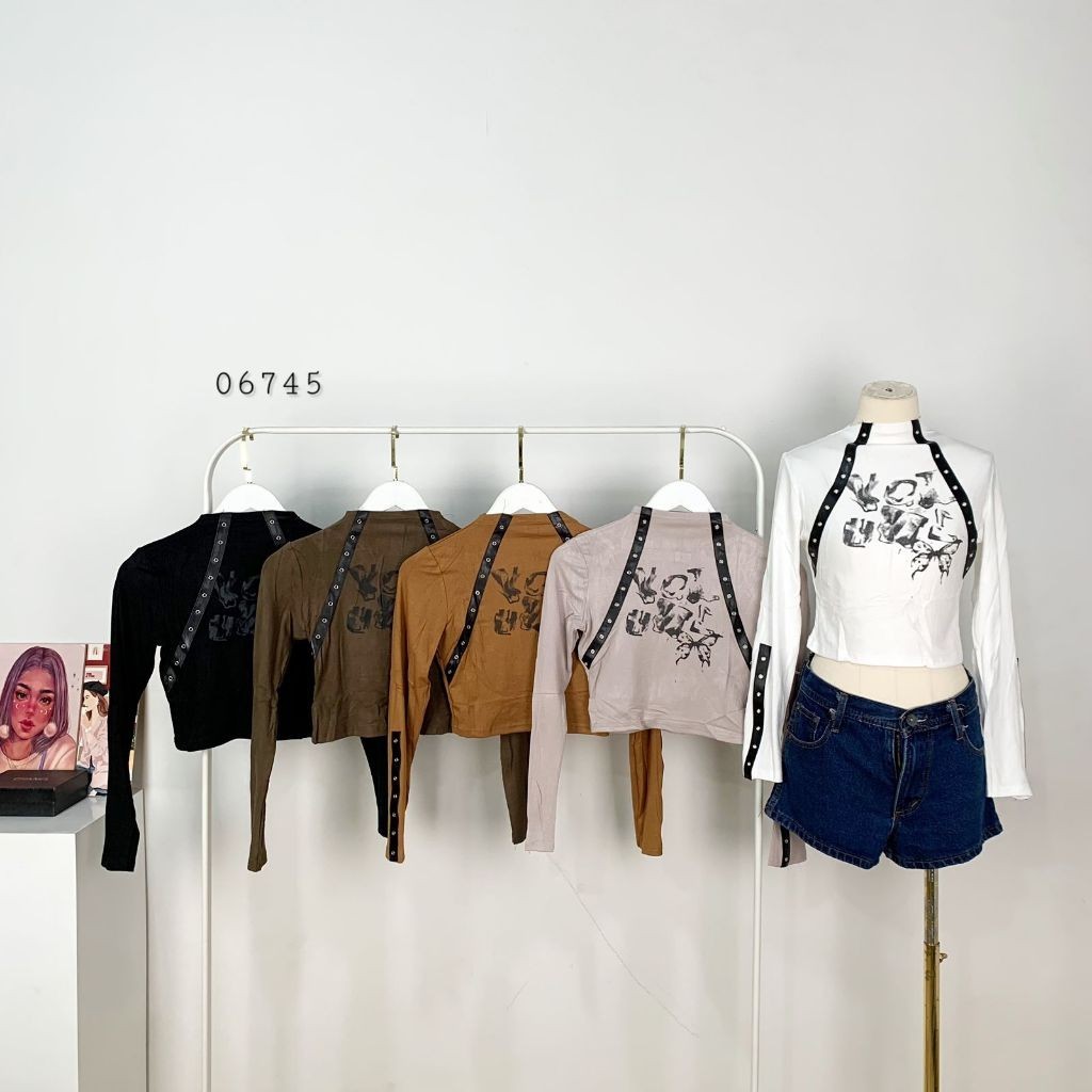 ATASAN BLOUSE CROP ABSTRAK VARIASI LEHER TANPA KERAH LENGAN PANJANG MIX ACC STRAP LUBANG BESI PREMIU