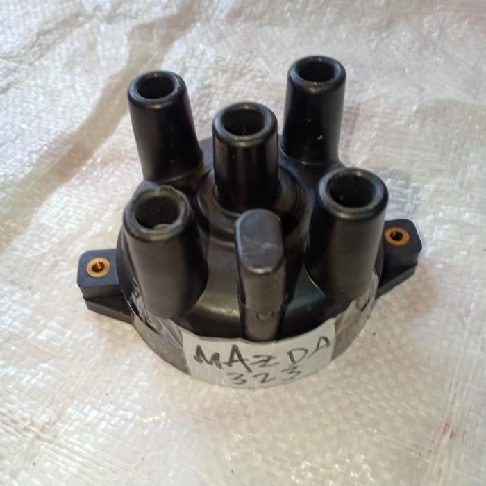 tutup delco Mazda 323 Ford laser