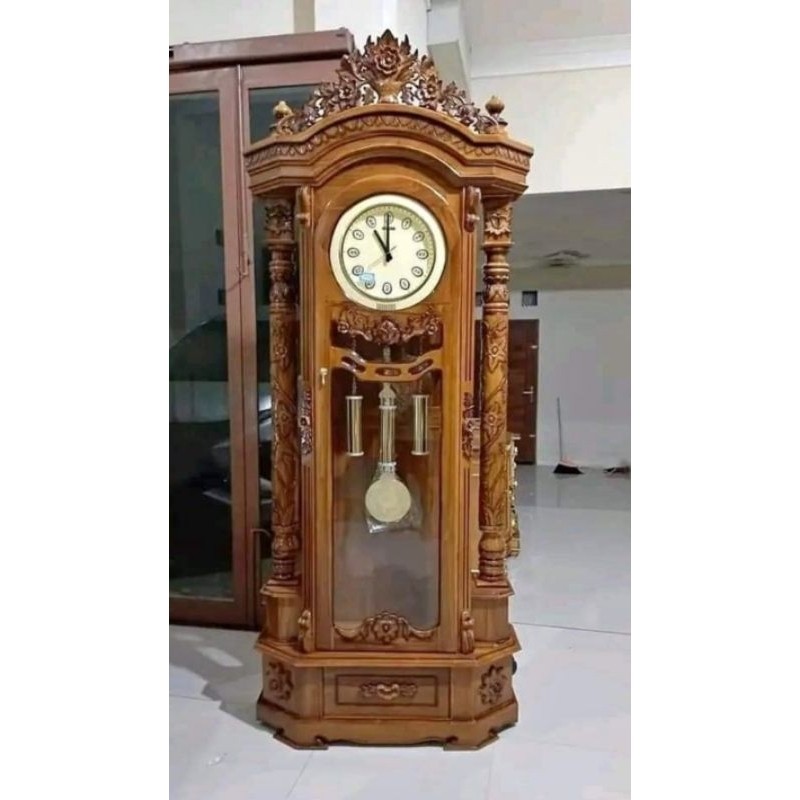 lemari jam jepara besar kayu jati