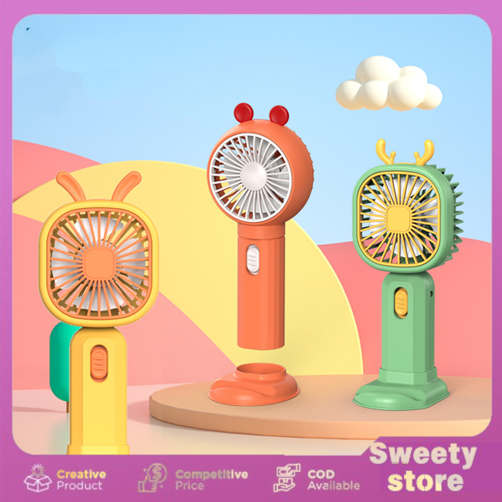 Kipas  Angin Mini Fan Small  Tangan Karakter Lucu Plas Dudukan Handphone Canggih /Kipas Angin Mini  