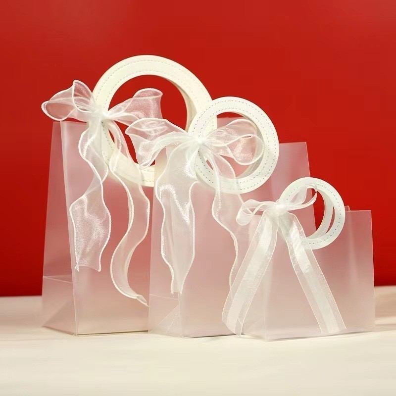 

LR Tas Mika PVC Doff Transparan Leather Handle / Goodie Bag Lebaran