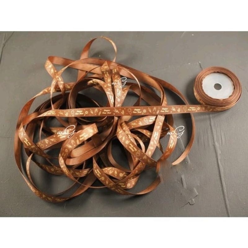 

Pita Happy New Year - Coklat Tua ;Lebar 1.2 cm ;Panjang 20 yard