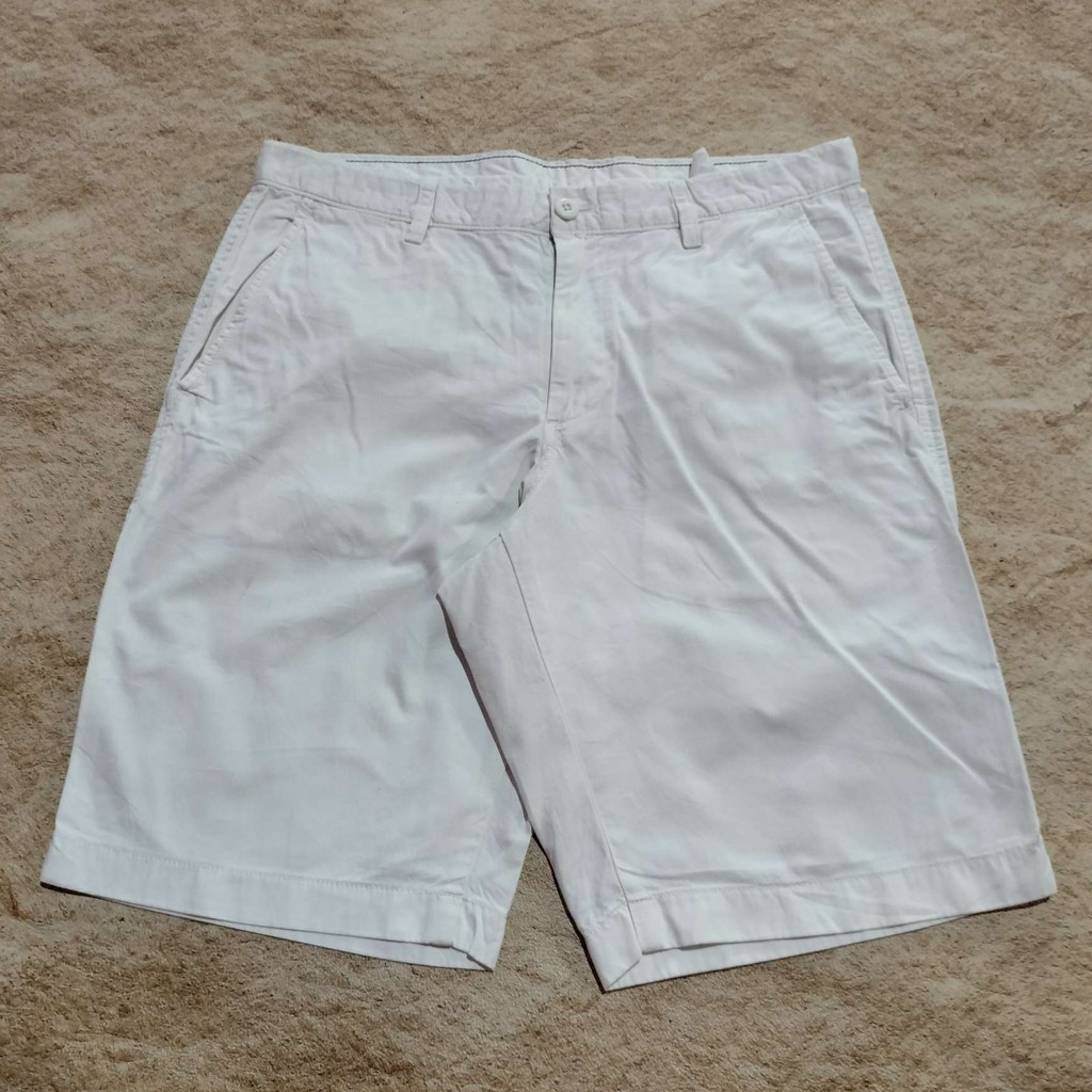 celana chinos UNIQLO putih tulang celana pendek pria casual size 33