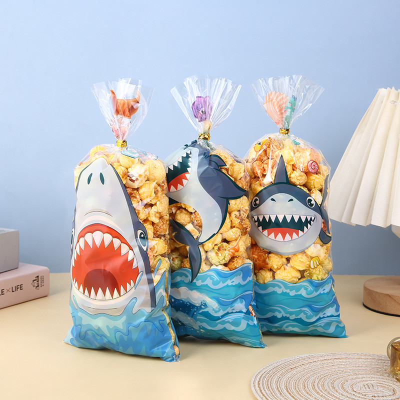 

50pcs Cute Cartoon Shark Head Transparent Opp Bag, Ocean Animals Printed Gift Candy Packaging Strip Flat Bags With Gold Ribbon