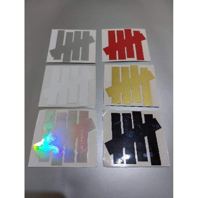 

STICKER LOGO UNDEFEATED CUTTING