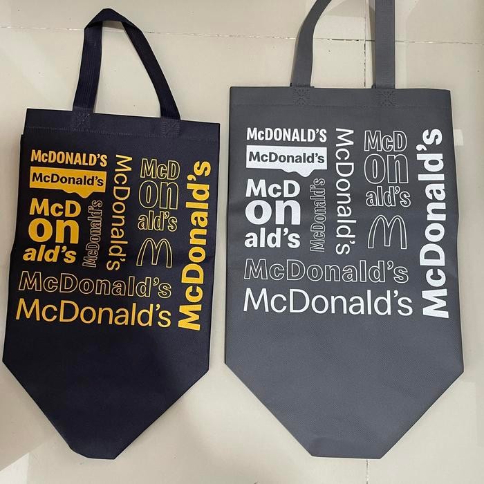 Terbaru Tas kain spunbond tote bag Mcd - Coklat huruf pink