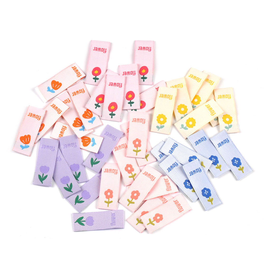 

50pcs 41x15mm Cute Flower Embroidery Labels DIY Garment Accessories Handmade Clothing Bag Shoes Tags Kids Sewing Crafts cp3630