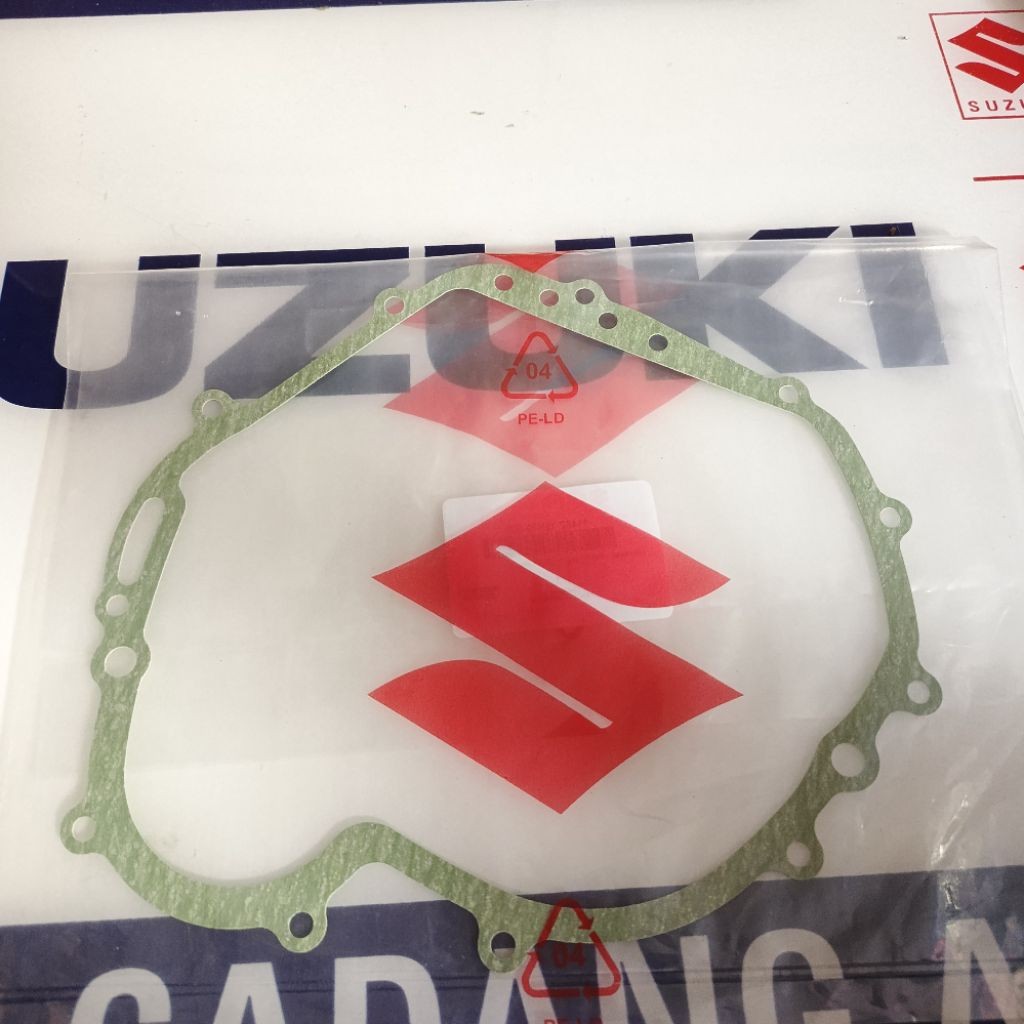 PAKING GASKET BAK KOPLING SHOGUN FL 125 PAKING BAK KOPLING SUZUKI SHOGUN FL 125 ORIGINAL SGP