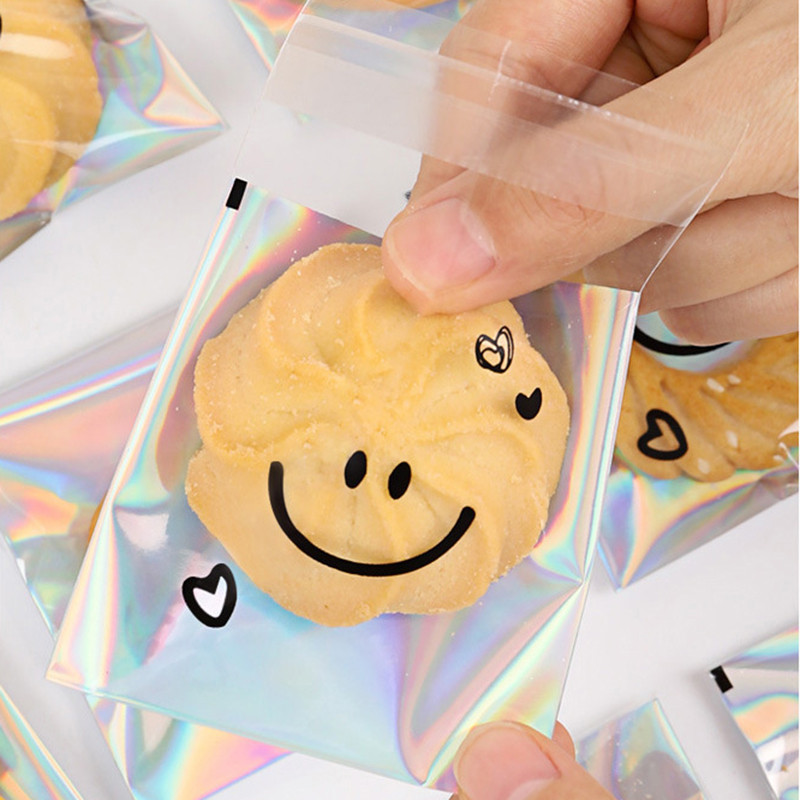 

100pcs Cute Smiling Face Cookie Packaging Bag Laser Transparent Biscuit Bag Self-adhesive Bag Birthday Party Wedding Decoration