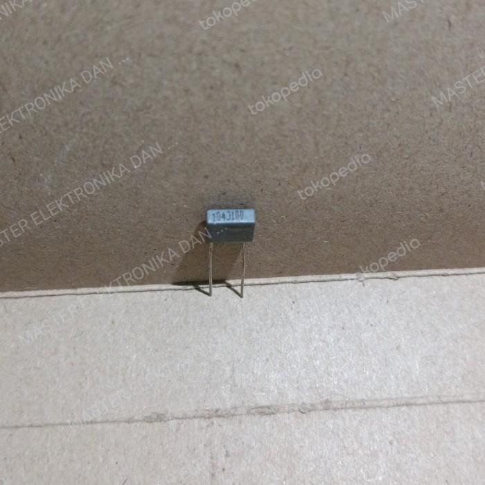 Part 7303 kapasitor mkm mkt 104j100 104j 104 100nf 100n 100v abu abu