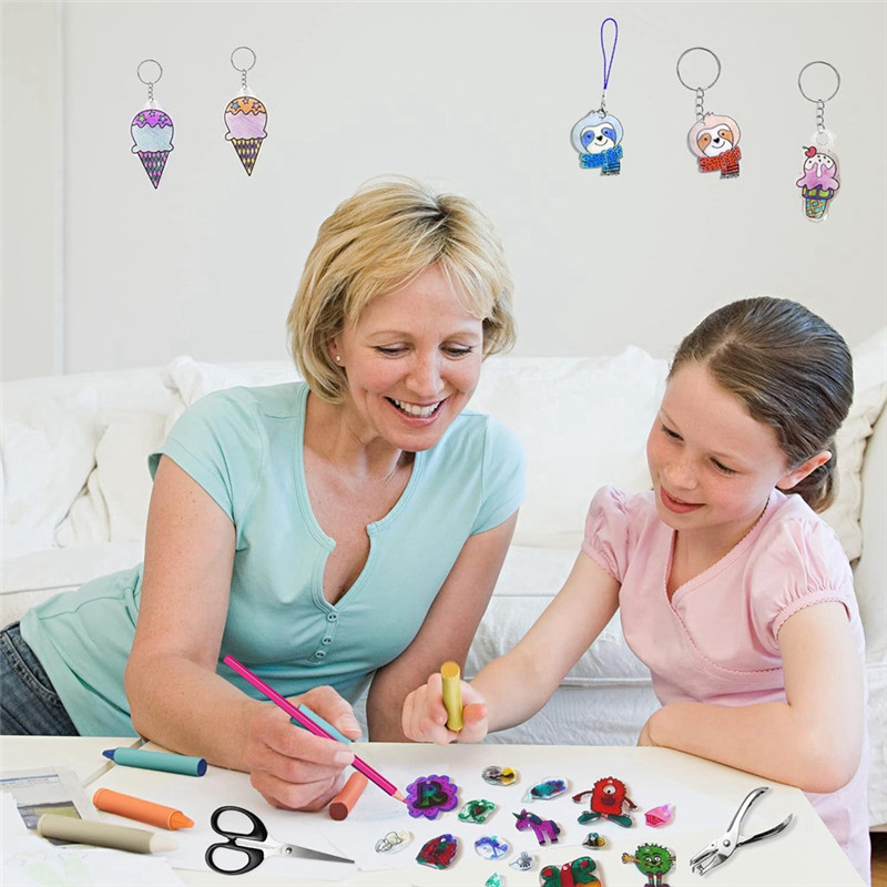 

A21R-165 PCS Shrink Plastic Kit - 15 Shrink Plastic Films, 5 Patterned Sheets, 12 Colored Pencils, 130 Keychain Accessories