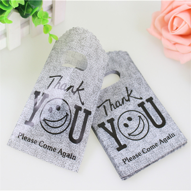 

50pcs/lot 9*15cm Lovely Gray Mini Thank You Gift Bags Smile Face Small Plastic Shopping Bags for Small Business Hot Sale