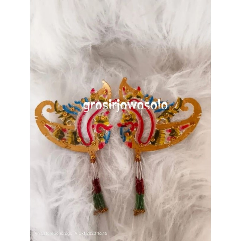 

DC___ Sumping Kulit Wayang Bentuk Segitiga Katun Mori