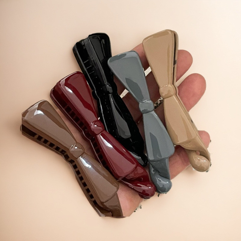 

2025 New Morandi Color Color Plastic Bow Banana Clip Clip Cute Literary Pastoral Style Girl Bangs Side Clip
