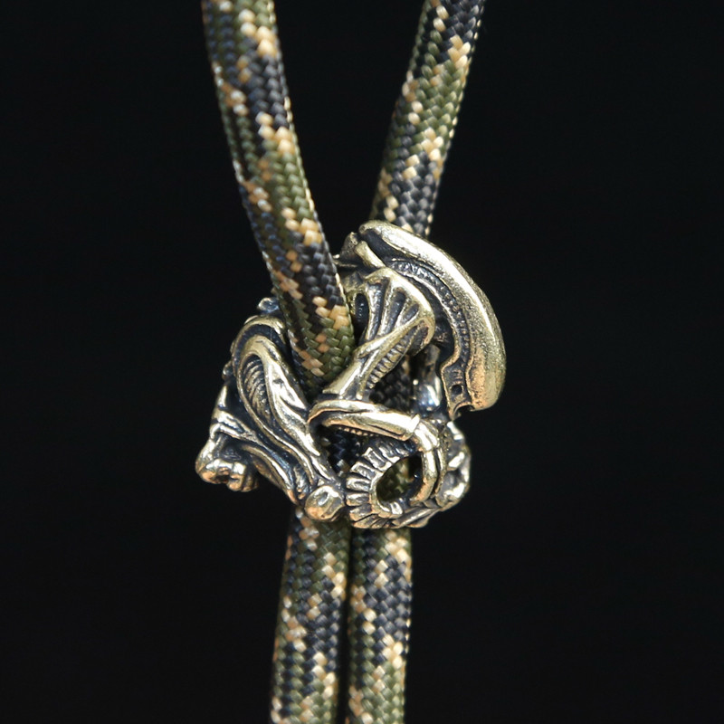 

Brass Alien Figures Paracord Beads Woven Lanyard DIY Pendant Jewelry Accessory Metal Charms for Bracelet EDC Survival Knife Bead